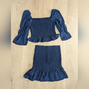 idem ditto off-the-shoulder smocked crop top with a matching ruffled mini skirt 